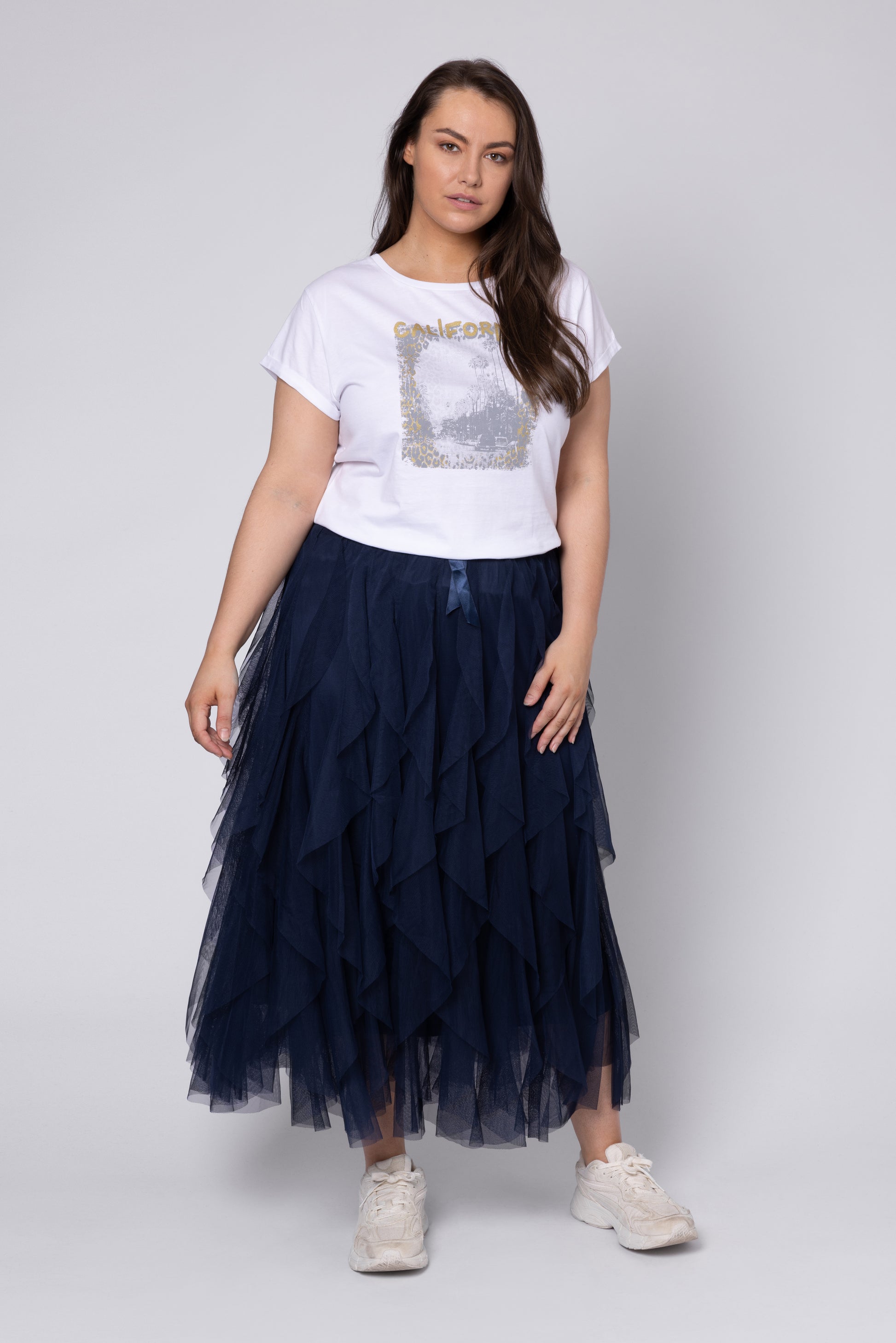 model wearing long navy tulle skirt