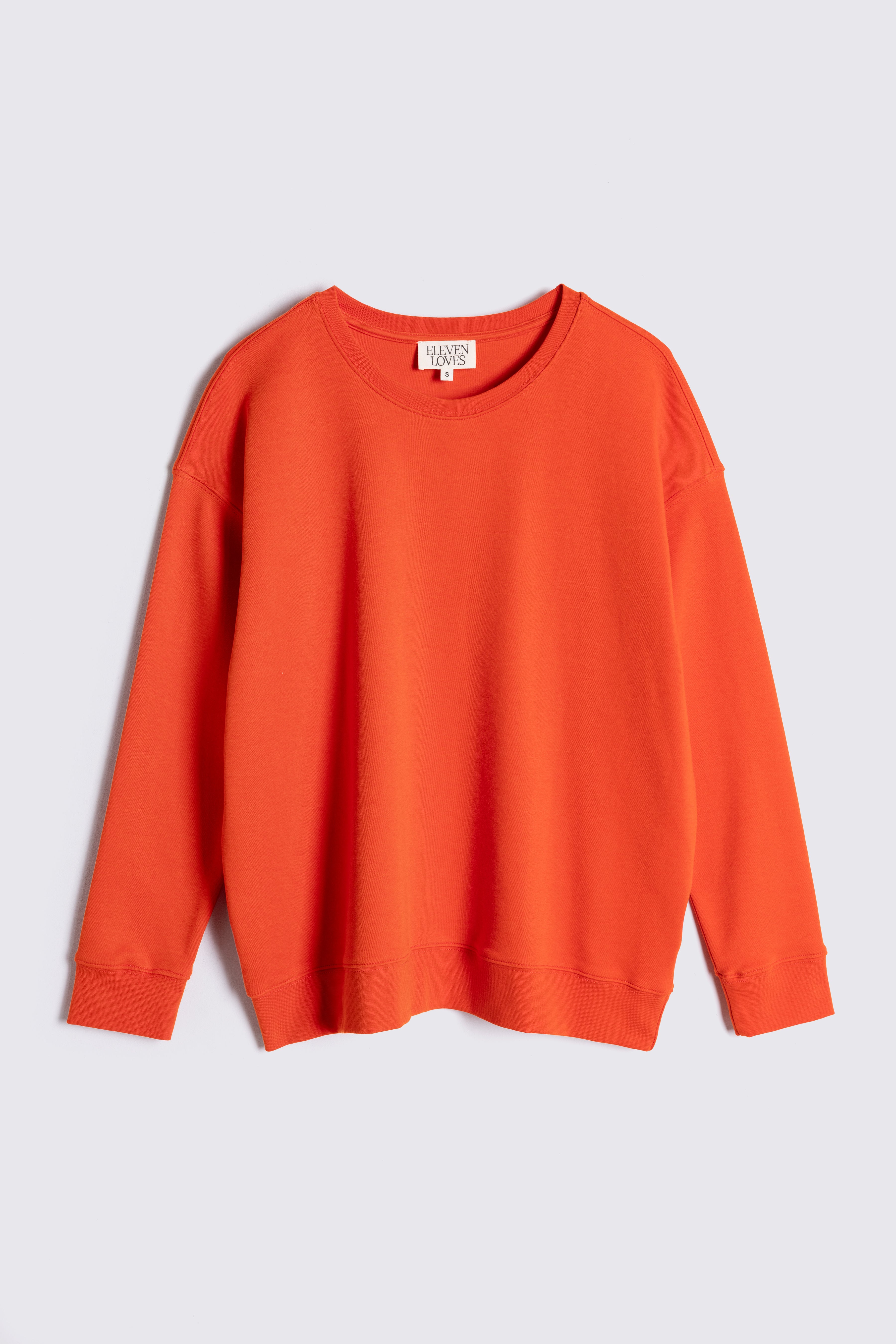 orange sweatshirt on white background