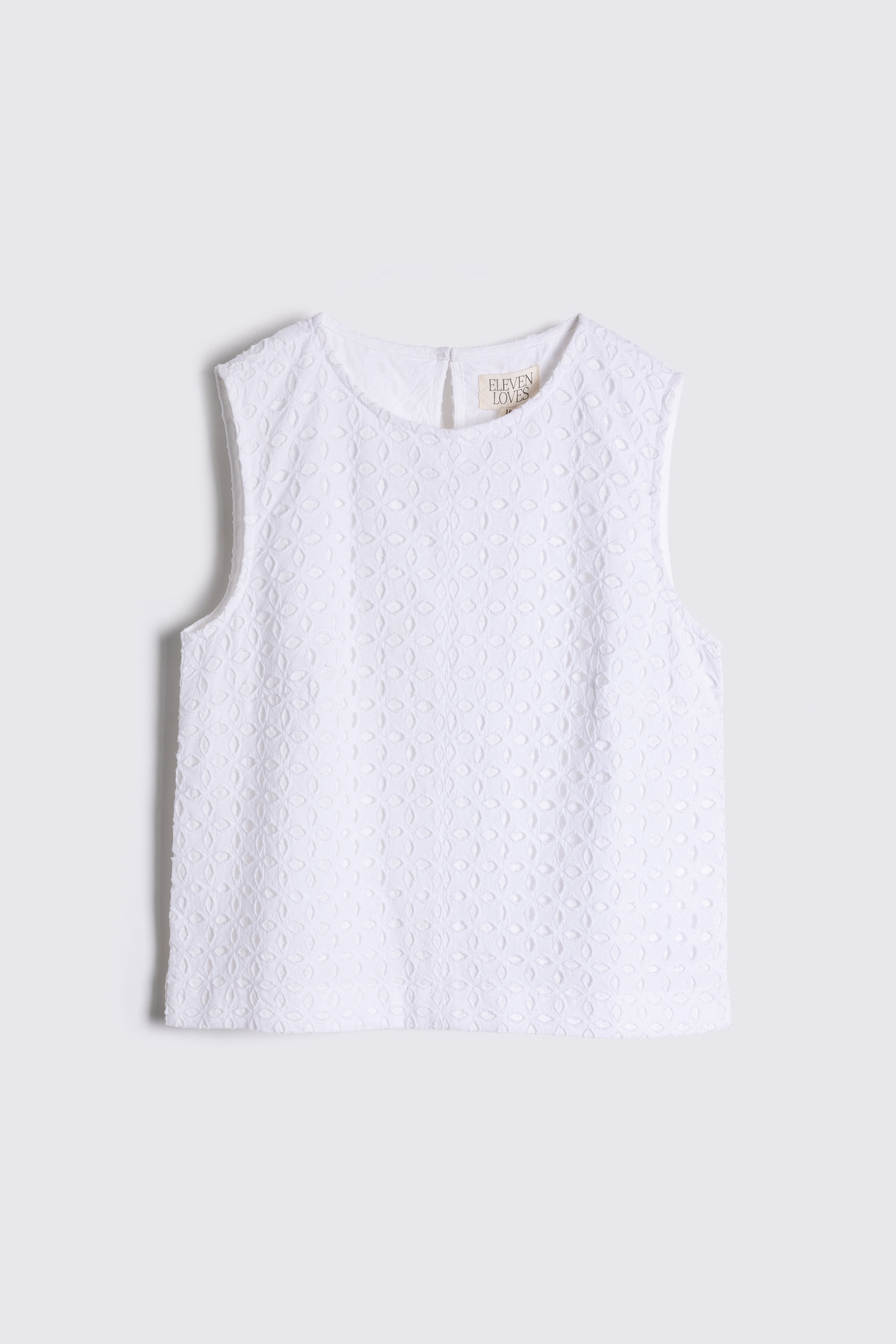 white Broderie top on white background