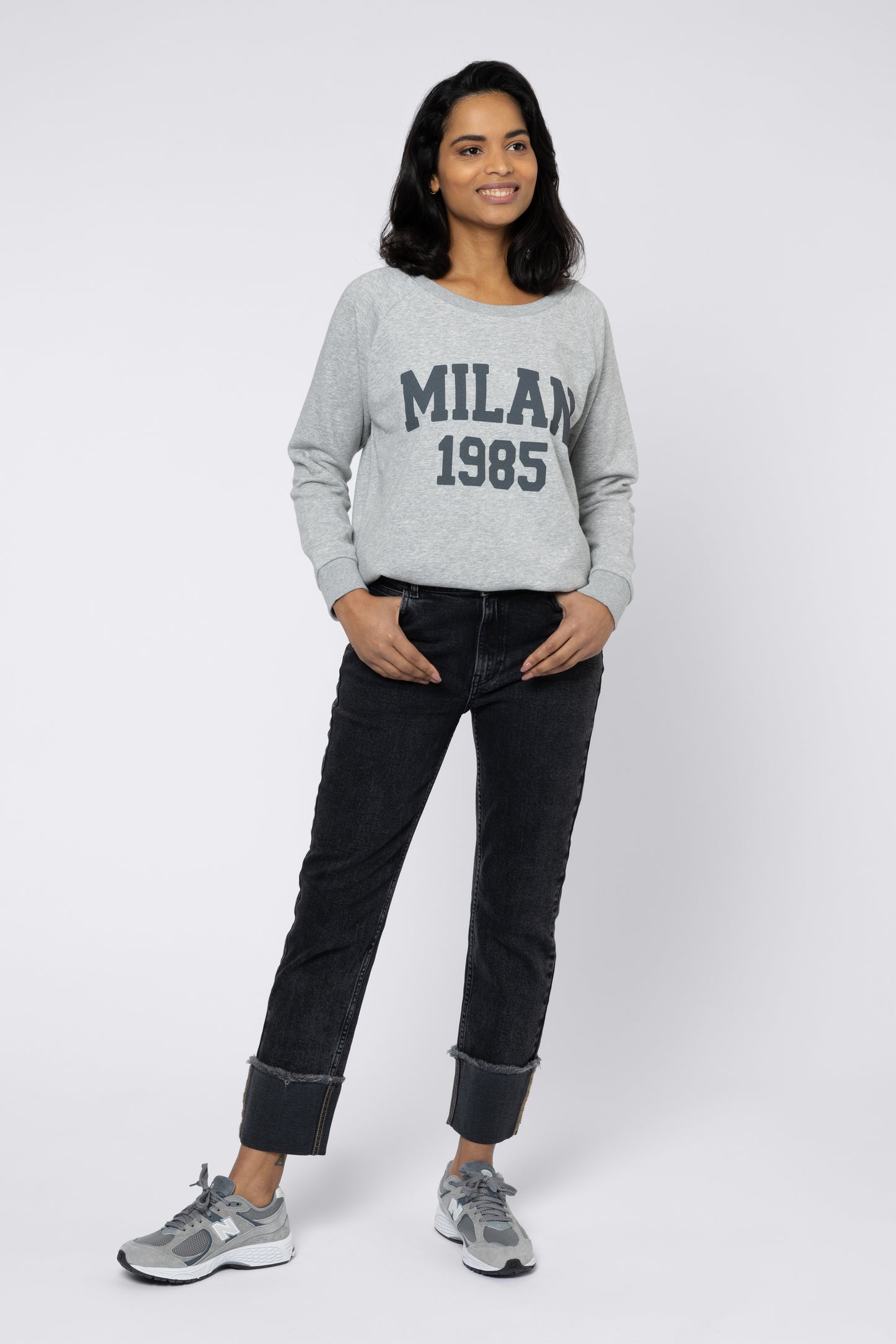 model wearing turn up jeans and sweatshirt